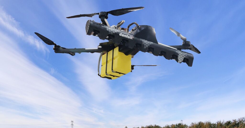 Image of UAV with precision sprayer mounted underneath